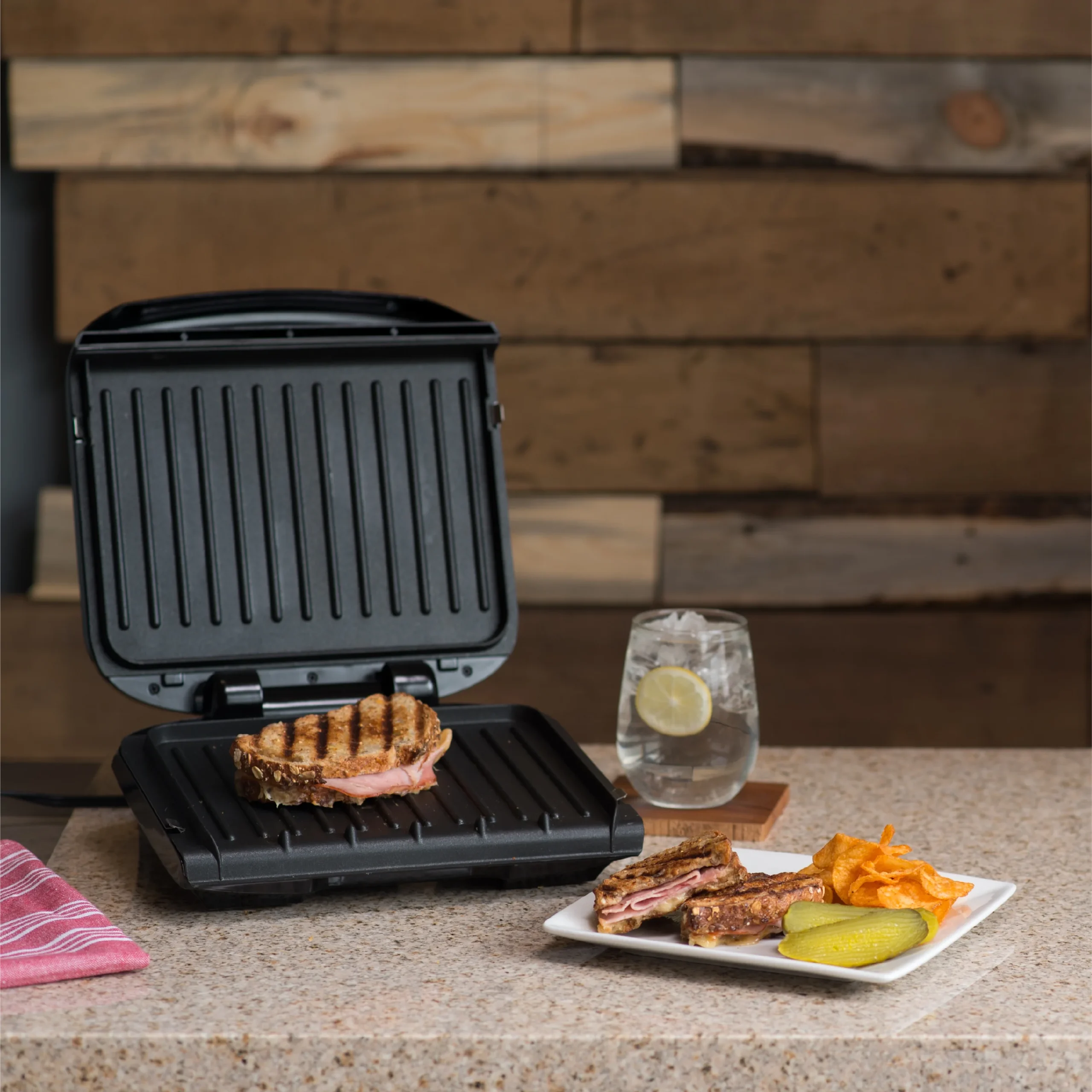George Foreman Grill - Indoor electric grill with sloped design for healthy fat-draining cooking and easy cleanup