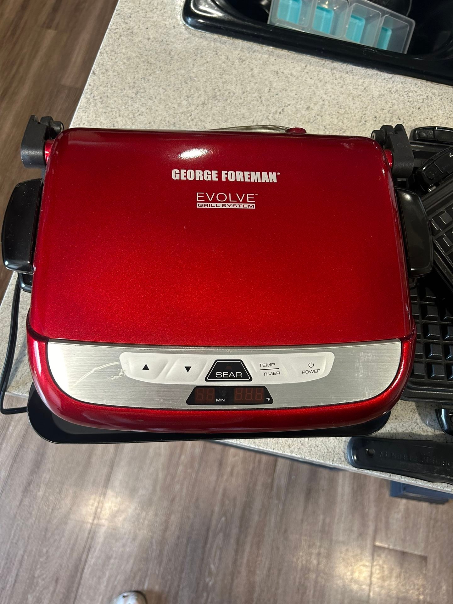 George Foreman Evolve Grill with interchangeable ceramic plates for grilling waffles and baking